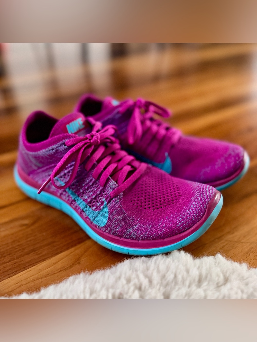 Nike Women's Magenta Flyknit Running Shoes with Turquoise Swoosh